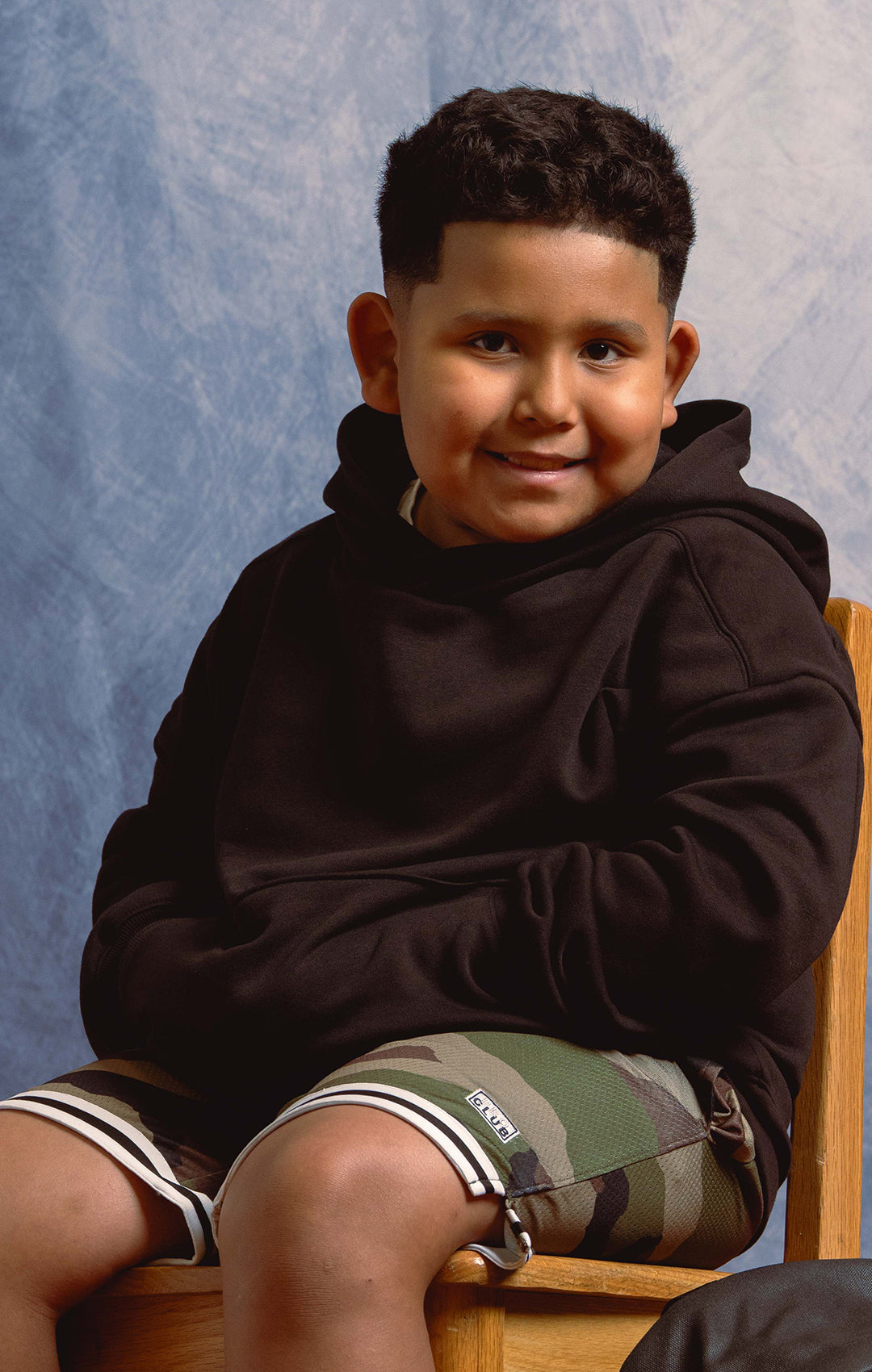 Kid in black hoodie